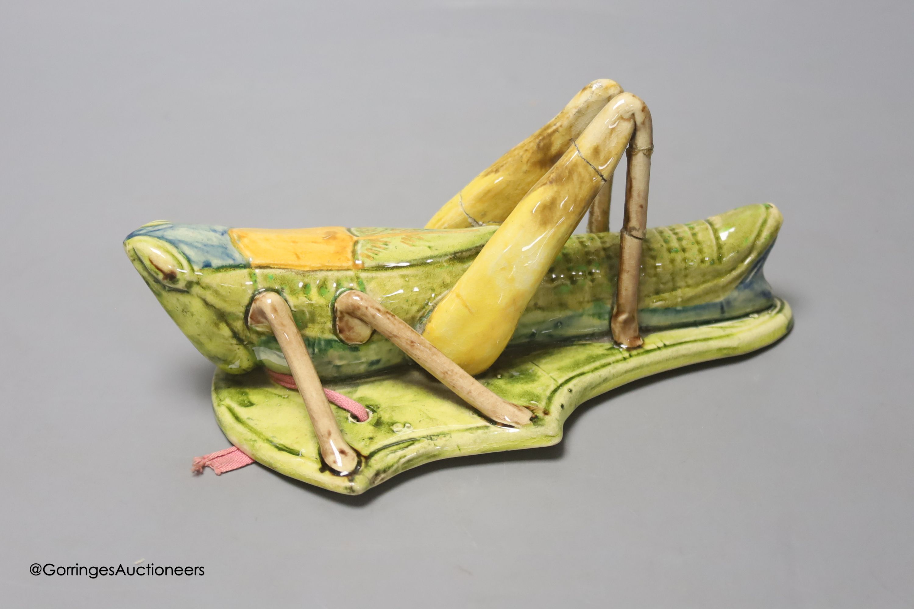 A Continental pottery 'grasshopper' wall pocket, early 20th century, possibly Caldas da Rainha, length 19cm
